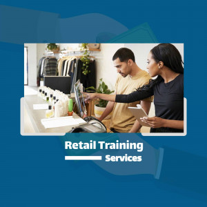 Two people looking at a computer screen in a retail store, discussing training.