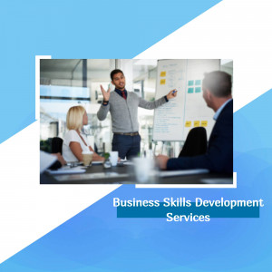 A business professional presenting to colleagues in a meeting.