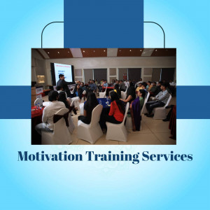 People attending a motivation training session in a conference hall.