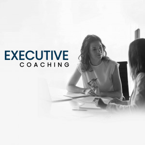 A woman in a business setting receiving executive coaching.
