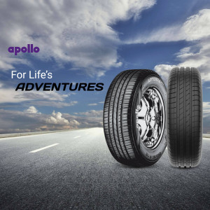 Apollo tyres displayed against a cloudy sky and road background
