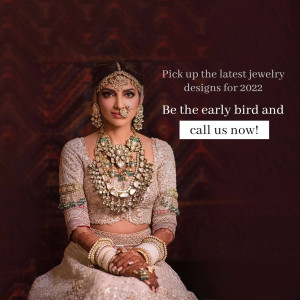 Indian woman wearing elaborate gold and gemstone jewelry