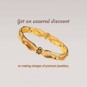 Close-up of a gold bangle with a discount offer text
