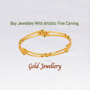 Close-up of a gold bangle with red and green detailing