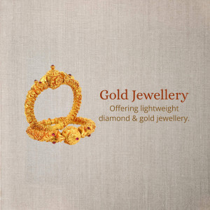 Close-up of a gold bangle with red gemstone accents against a textured beige background.