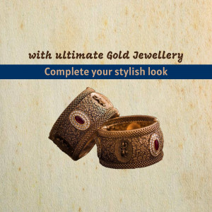 Close-up of ornate gold bangles with red gemstone accents.