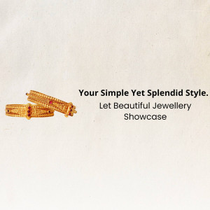 Close-up of two gold bangles with red stone detailing