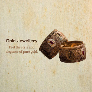 Close-up of two ornate gold bangles with red gemstone accents.