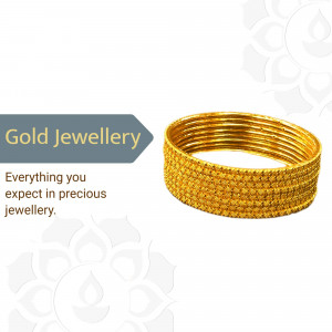 Stack of shiny gold bangles on a white background