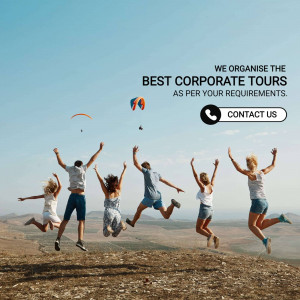 Group of people jumping for joy with a paraglider in the background, promoting corporate tours.