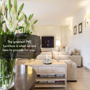 A bright and airy living room with a vase of white lilies and a comfortable beige sofa.