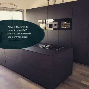 A sleek, modern kitchen featuring dark grey PVC cabinets and a kitchen island.