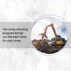 Excavator claw lifting scrap metal at a recycling facility