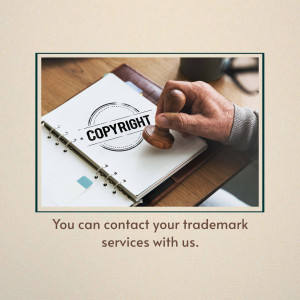 Hand stamping a copyright symbol on a notebook