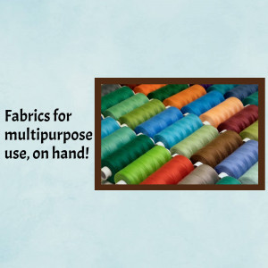 A collection of colorful spools of thread and fabric.