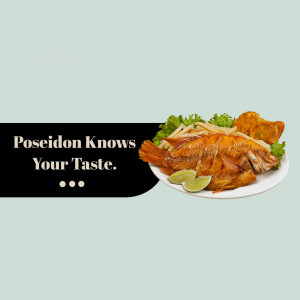 A plate of fried fish with french fries, lettuce, and lime wedges.