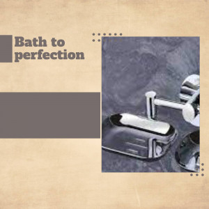 Close-up of modern chrome bathroom fixtures including a soap dispenser and dish.