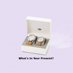 Two Fossil watches in a white gift box
