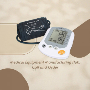 Digital blood pressure monitor and manual cuff on a beige surface