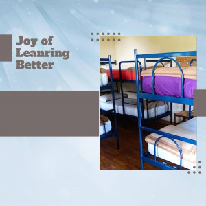 A dormitory room with multiple bunk beds, showcasing a learning environment.