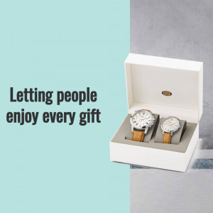 Two Fossil watches in a white gift box with the text 'Letting people enjoy every gift'