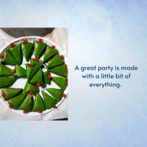 A circular platter filled with triangular paan (betel leaf) bites, garnished with small red cherries.
