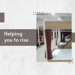 Interior view of a capsule hotel with multiple pods and a welcoming message.