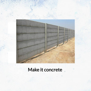 A long concrete wall with interlocking blocks, viewed from a low angle.