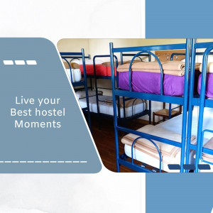Interior view of a hostel dormitory with bunk beds and neatly made beds.
