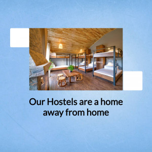 Interior view of a clean and inviting hostel room with bunk beds and a common area.