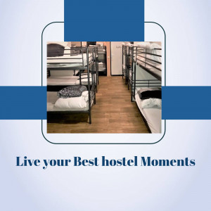 Interior view of a hostel dormitory with bunk beds and a welcoming atmosphere.