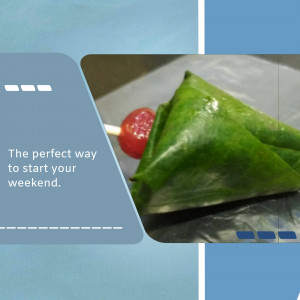 A close-up of a paan, a traditional South Asian dessert wrapped in a betel leaf.