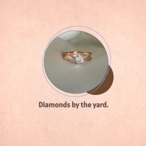 Close-up of a rose gold engagement ring with a solitaire diamond