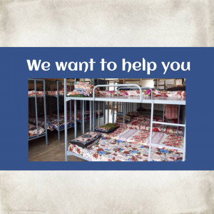 Rows of bunk beds in a refugee shelter, offering assistance and support.