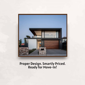 Exterior view of a modern, two-story house with a dark and light color scheme.