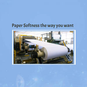 Image of a paper roll being produced on a large industrial machine.