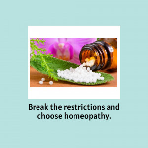 Close-up of homeopathic pills and a bottle on a green leaf