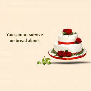 A three-tiered white cake decorated with red roses and ribbon, with the quote 'You cannot survive on bread alone.'