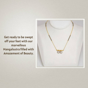 Close-up of a gold and black beaded mangalsutra necklace on a mannequin.