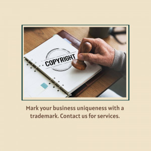 Hand stamping a copyright symbol on a notebook