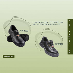 Two black safety shoes with steel toes on a light green background.