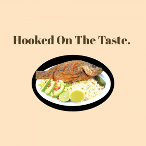 A close-up of a fried fish platter with rice, salad, and lime.