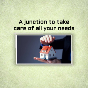 A hand holding a miniature house over a light green background with text.