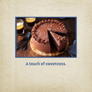A close-up of a chocolate cake with a slice removed, served with espresso.