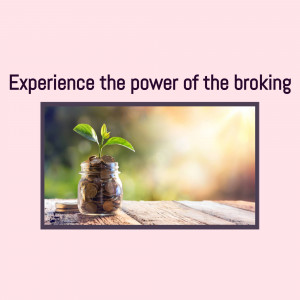 A small plant growing out of a glass jar filled with coins, symbolizing financial growth and investment.