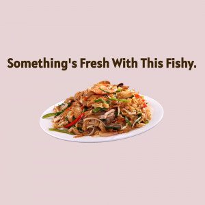 A plate of seafood stir-fry with shrimp and vegetables.