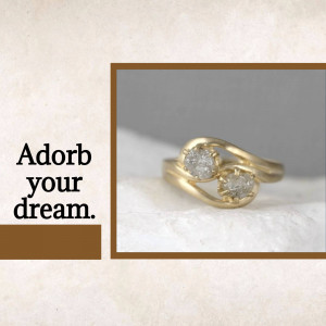 Close-up of a gold ring with two raw diamonds