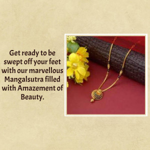Close-up of a gold mangalsutra necklace with black beads and a yellow flower.