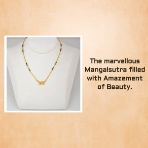Close-up of a gold Mangalsutra necklace on a mannequin