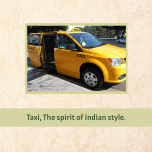 A yellow taxi with its door open on a city street.